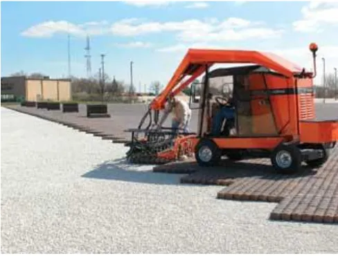 Figure 3.12 - This machine provides a mechanical means of laying blocks of pavers (Interlocking Concrete Pavement Institute 2008)