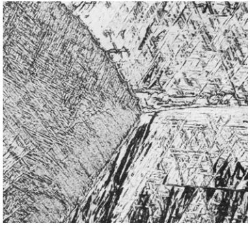 Figure 2.2:  Micrographs of Ti-6Al-4V solution heat treated above the β transus at 1066°C and (a) water quenched (×500) [4], (b) air cooled (×250), and (c) furnace cooled (×250) [5]