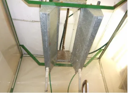 Figure 12. The oscillating boom rainfall simulator used for the testing. The pictures shows the two nozzles as they oscillate from one side to another 
