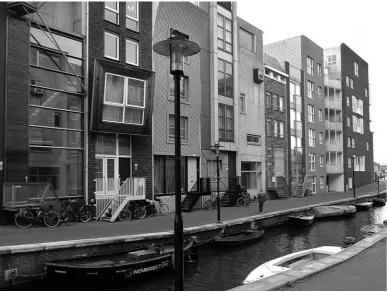 Figure 12.  The structure of narrow and deep “gothic” plots, reminescent of the ancient structure of the Historic city centre, is clearly visible in this shot of the side canals waterfront in Java Island, Amsterdam