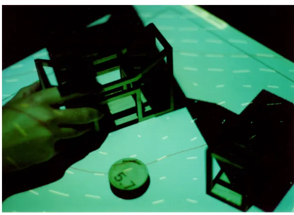 Fig. 2.1 Urp [241], a TUI for urban planning that combines physical models with interactivesimualation