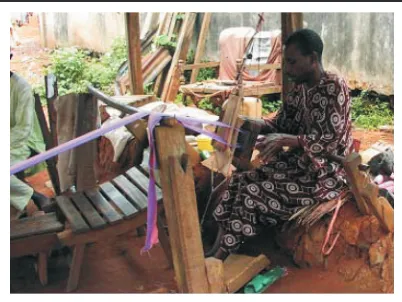 Figure 3. Male Weaver Using Horizontal Loom.