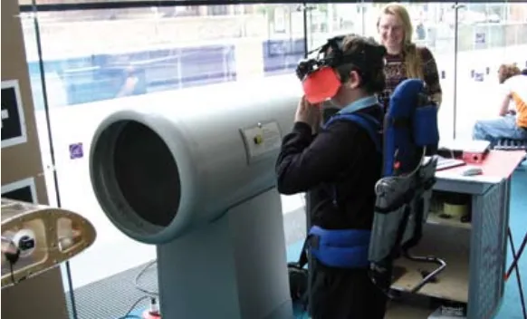 Figure 3: Child using headset to view augmented reality demonstration of airflow over a model aeroplane wing