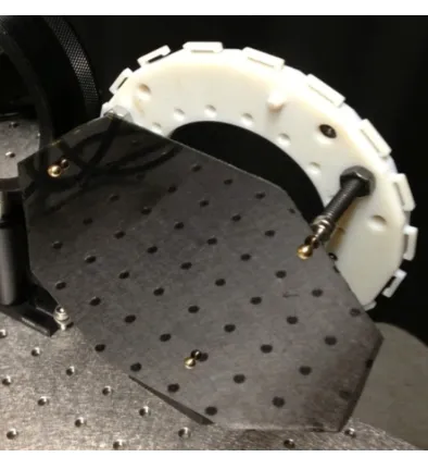 Figure 2.7: Bare CFRP substrate mounted using spherical magnets.