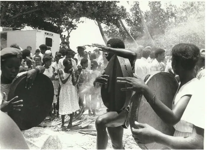 Fig. 3. ‘Young Pioneers’ of the Second Republic being taught to play the moutya drums [1985?]