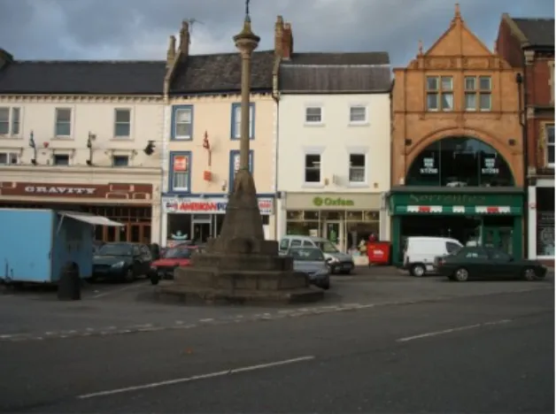 Fig. 8.  North side of the Market Place with the market cross in the foreground. The on street car