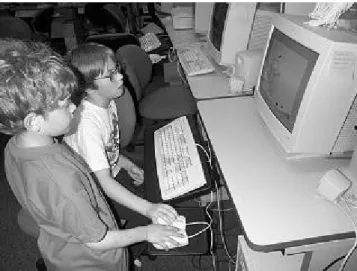 Figure 1: Two children using two mice with one computer.  They are running KidPad, an application we wrote that uses MID.