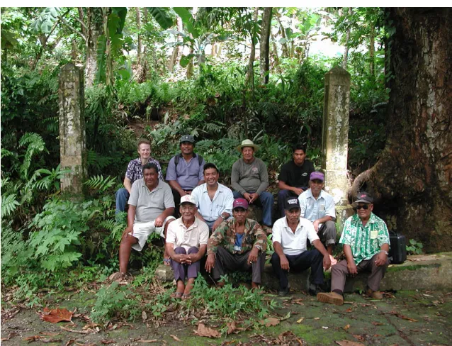 Figure 5.22: Survey group with some Chuukese war survivors in front of gate  posts, all that remain of a comfort house on Tonoas (Photograph by Anerit Mailo, 2001)