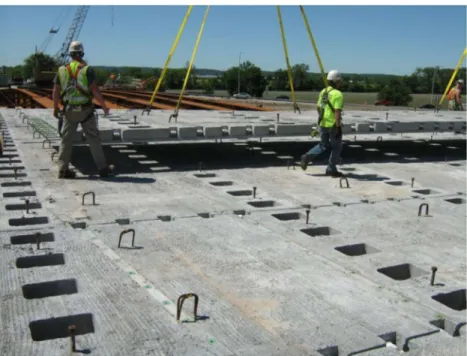 Figure 2.5.  Bridge deck being constructed with full-depth precast concrete deck  panels (Chavel, 2012) 