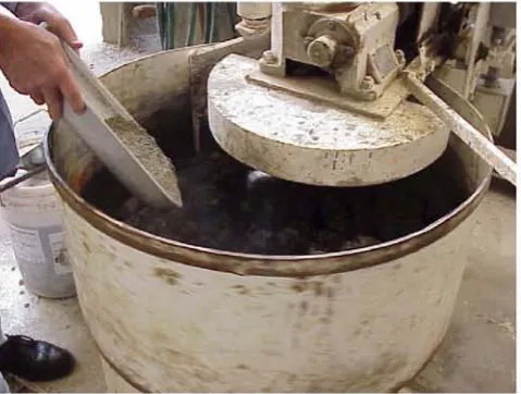 Figure 5.7- Paste Fill Being Mixed in the Cement Mixer as Cement is Added