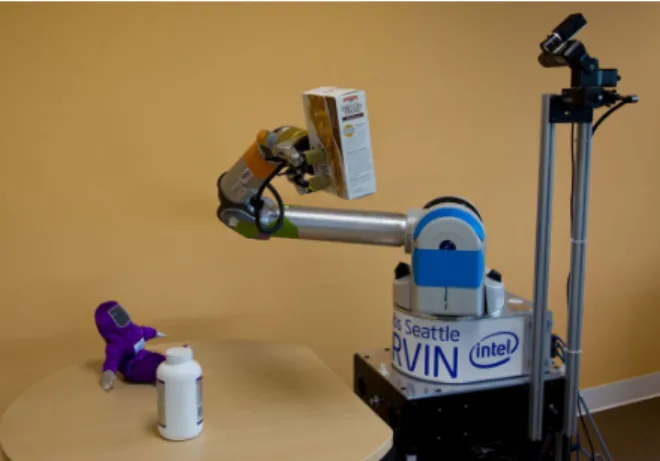 Fig. 1. Experimental platform. We used a WAM arm with BarrettHand on a Segway base. Mounted next to the arm on a pan-tilt unit is a depth camera.