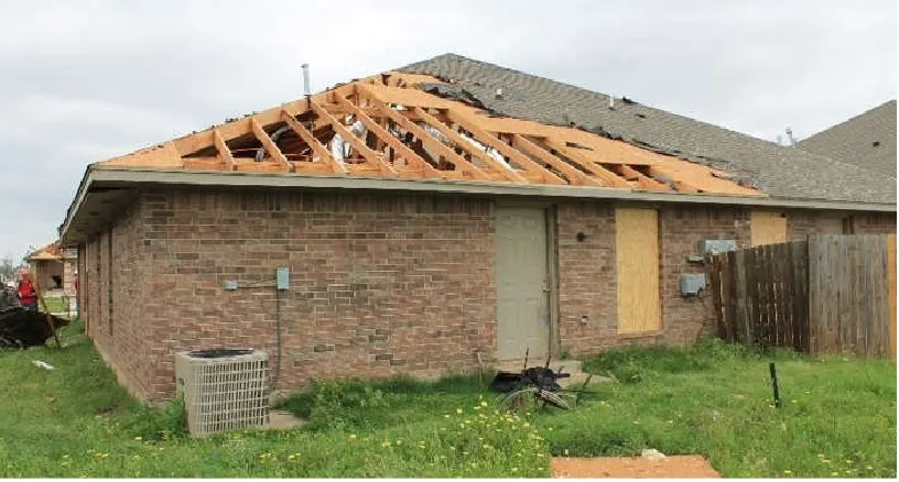 Figure 1-2: Example of roof-to-wall connection failure, corresponding to DOD-6 (Image provided by Dr