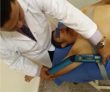 Figure 7b: Measuring shoulder internal rotation                          using a laser goniometer.