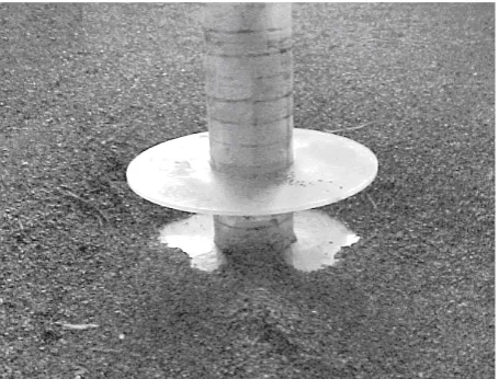 Figure 6. Scour hole around pier protected by two collar (TestNo. 4)-looking downstream