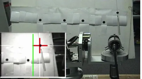 Fig. 1.The current target-object’s position in the robot’s view (inset lowerleft) is marked with a red cross