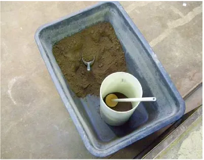 Figure 6.5 Compacting Soil Sample to Ensure Even Density 