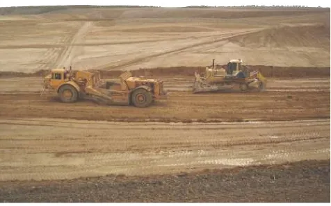 Figure 8 : A Scraper and Bull Dozer travelling on overburden deposits 