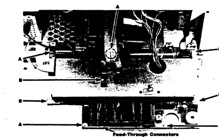 figure 6-6). Disconnect these cables from grommeted hole. 