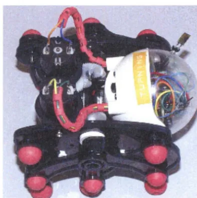 Figure 3.5controlling t hecon: T his robot, built from a toy kit produced by the Elekit company, tains only two sensors oriented at a 90° from each other, with their mid-angle located along the robot's apparent line of motion