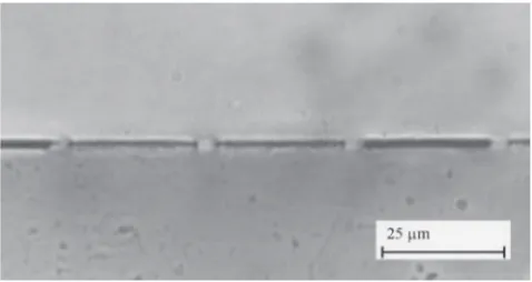 Fig. 4Laser welded sample in cross section. The tops of the 5 µm widetracks have been welded to the top sheet of PMMA