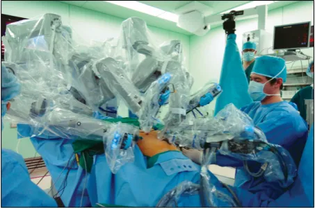 Fig. 2. The operating theater with the da Vincisystem.Total mesorectal excision is performed using the da Vincisystem.