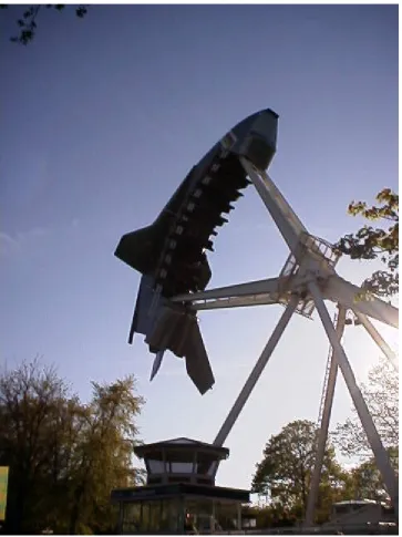 Figure 4. A giant pendulum with a counter weight. Additional energy is provided every time the pendulum passes the lowest point until it makes a full turn with riders hanging 