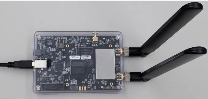 Figure 4.2 shows a photograph of the actual bladeRF device, with USBcable plugged in and antennas attached to the transmit and receive ports.