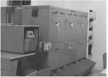 Figure 4: The communications bay showing the punches re-perforating paper tape transmissions from the branches, c