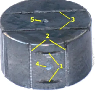 Fig. 2.  Al-Si briquette with slits oriented for LTEC measurements in lengthwise (1), chord (2) and radial (3) directions; 4, 5 indicate holes for thermocouples