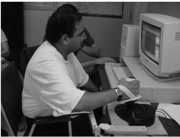 Figure 1: Prototype web-based, force feedback  telerehabilitator (“Java Therapy”) being used for therapy.