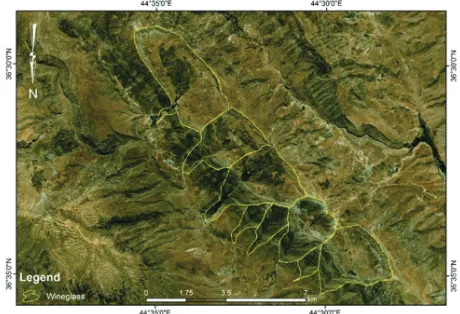 Fig. 4. QuickBird image, facing south of Pera Magroon anticline. Note the large-wine glass form (in yellow); the developed Zewe alluvial fan (in red) and Qara Chatan landslide (in black).