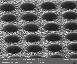 Figure 7: SEM image of photolithography on textured surface. The round “island” are impressed photoresist, it can be seen how the photoresist is not well defined but has round edges