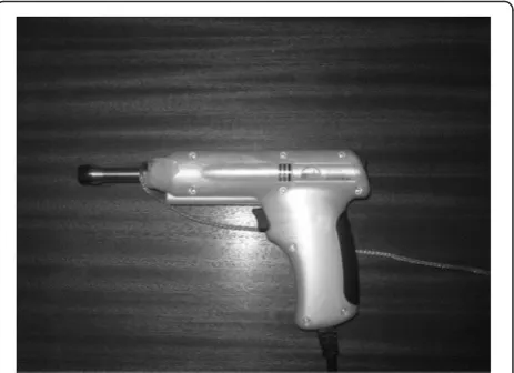 Fig. 1 Impulse adjusting instrument set on the second force setting(200 N). The stylus base was connected by a ground wire to thescreened floor to decrease interference on sEMG