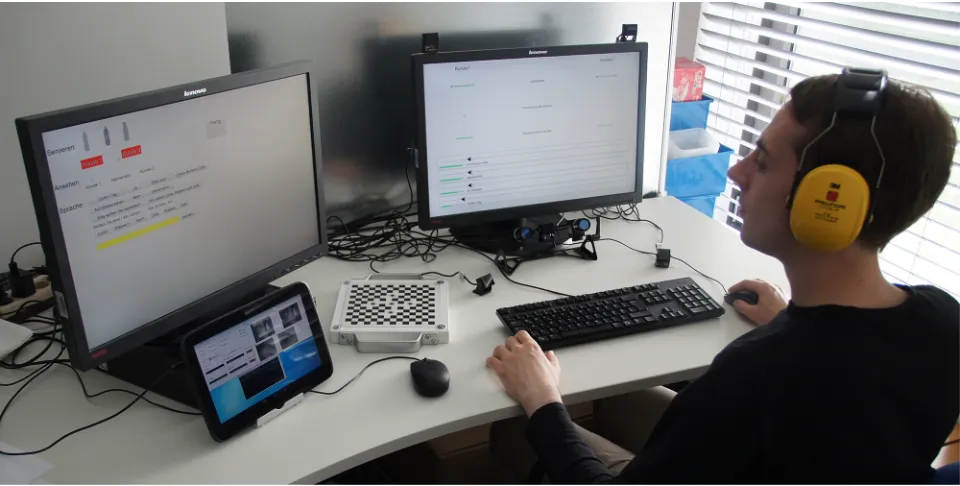 Fig 1. Setting of the study. The setting for the ghost participants including the information panel, eye tracker, control panel and eye tracker controlscreen