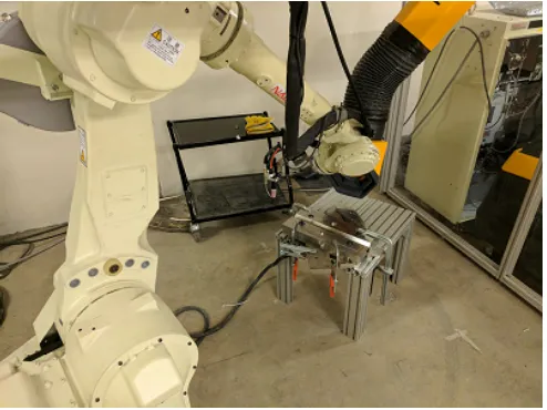 Fig. 1.Lab set-up of the welding task. The welding robot is a NACHIMC70. The actual monitoring robot is not shown in this set-up.