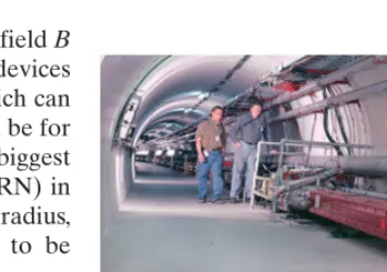 FIGURE 32–3 The interior of thetunnel of the main accelerator atFermilab, showing (red) the ring ofsuperconducting magnets used tokeep particles moving in a circularpath at the 1-TeV Tevatron.