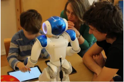Figure 1: Thomas teaching a Nao robot how to writenumbers, with the help of an occupational therapist.