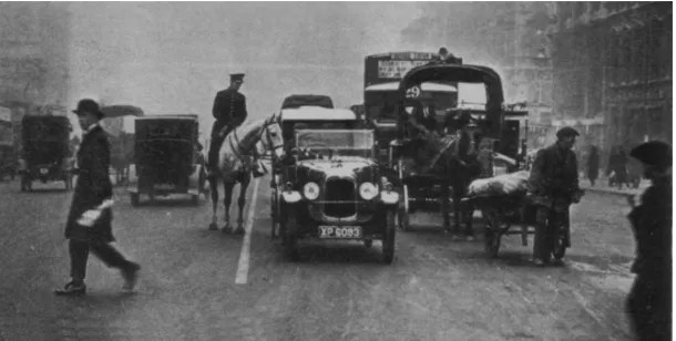 Figure 1: 1924 image from Morton (1934). This is the first white line to be laid down in a London street as an experiment in solving the traffic congestion problem, which at this time had become acute