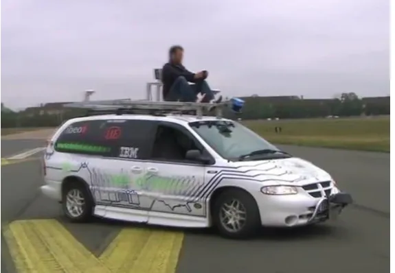 Figure 2: Example contested video demo: A researcher remotely controls the robotic  car with his smart phone