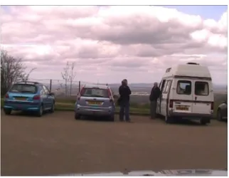 Figure 3.5 still from video of man leaning against his camper van 