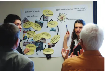 Figure 1 Participants discussing the issues as they complete a wall template