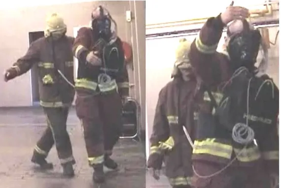 Figure 1, Searching fire fighters in a trial with the visor aid, note the arms exploring the Haptic Space