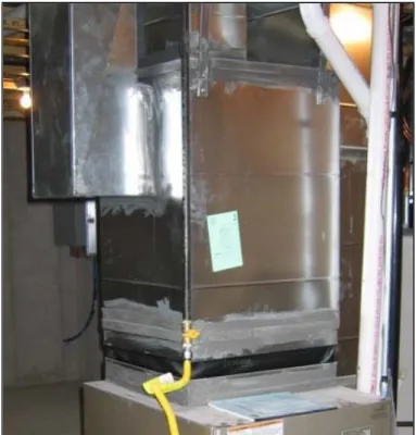 Figure 1. Sheet metal supply plenum sealed with mastic. A flexible, fireproof canvas collar was installed to  provide sound/vibration attenuation