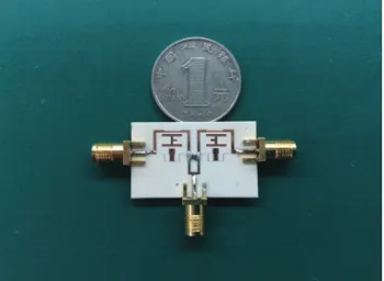 Figure 9. Simulated and measured S-parametersof the designed UWB power divider with dualnotched bands.