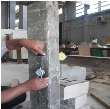 Figure 3. Composite basalt column under concentric load with strain and buckling (deflection) gages (transducers)