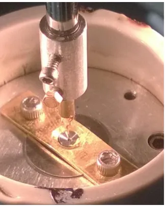 Figure 2.5 Drilling the hole using micro-EDM in Be gasket. 