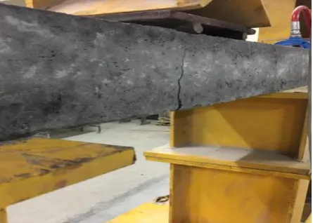 Fig.17: Deflectometer and LVDT placed in the Specimen         Fig.18: Deflected shape of the beam  