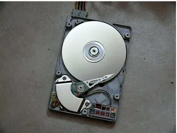 Figure 1.1:The inside of a hard disk drive. It is a device for storing and retrieving digitalinformation