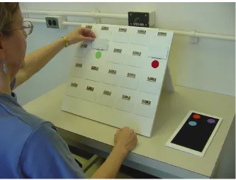 Figure 2.1. A photograph of a participant selecting a non-matching pair on the spatial 