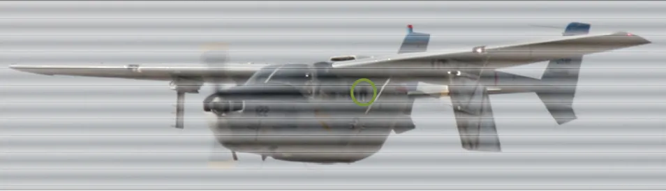Figure 1. Cessna O-2A Skymaster with SWIFTER on the port outboard hardpoint with the IR camera port circled in green